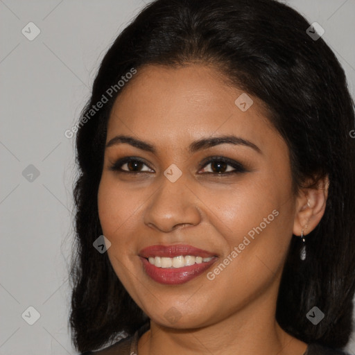 Joyful latino young-adult female with long  brown hair and brown eyes