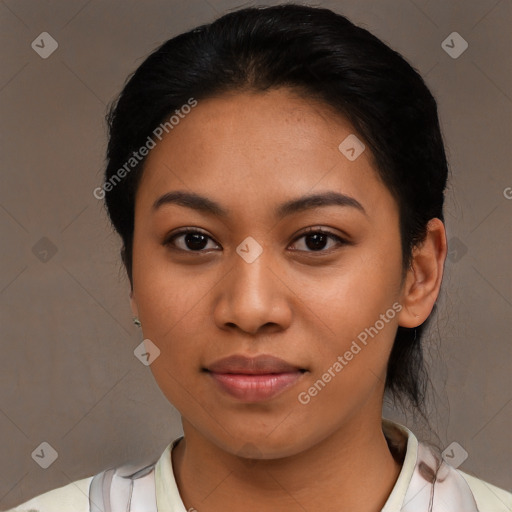 Joyful latino young-adult female with short  black hair and brown eyes