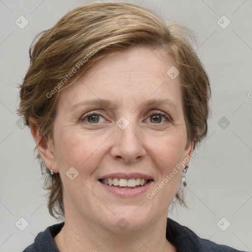 Joyful white adult female with medium  brown hair and blue eyes