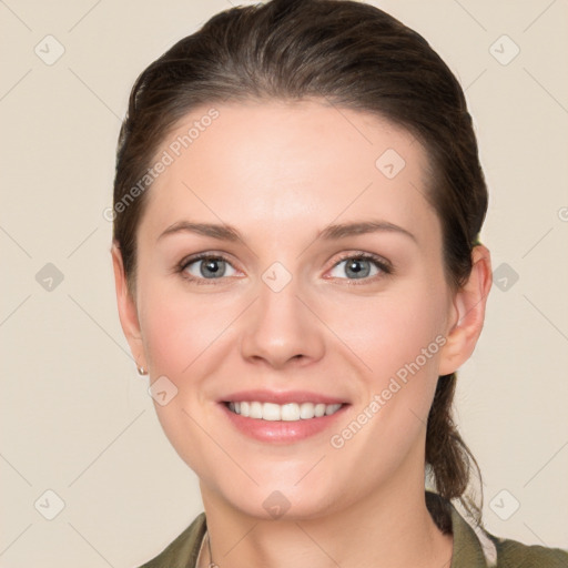 Joyful white young-adult female with long  brown hair and grey eyes