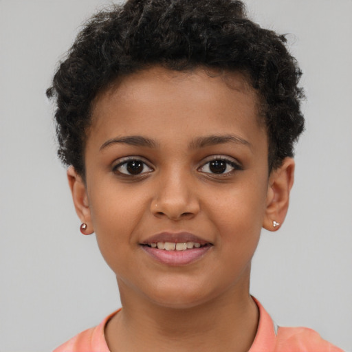 Joyful latino child female with short  brown hair and brown eyes