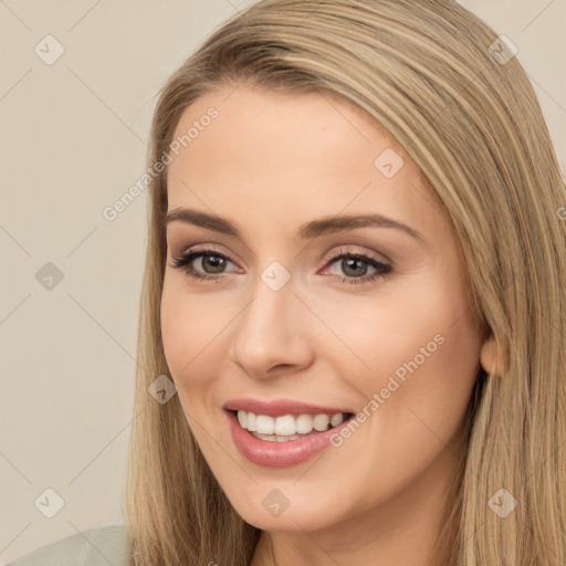 Joyful white young-adult female with long  brown hair and brown eyes