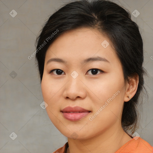 Joyful asian young-adult female with medium  black hair and brown eyes