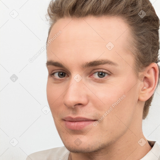 Neutral white young-adult male with short  brown hair and brown eyes