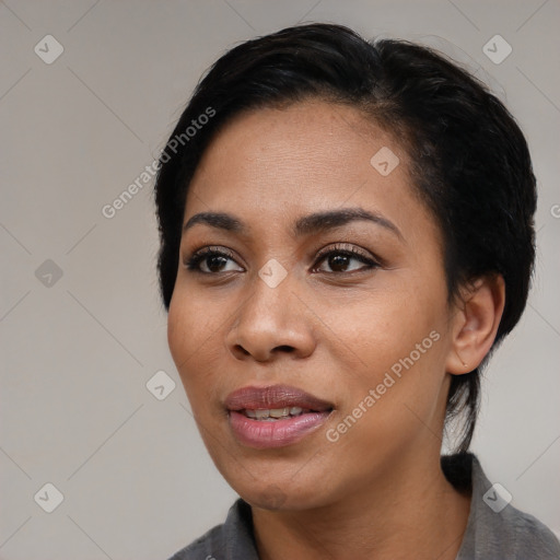 Joyful black young-adult female with medium  black hair and brown eyes