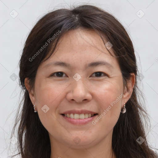 Joyful white adult female with long  brown hair and brown eyes