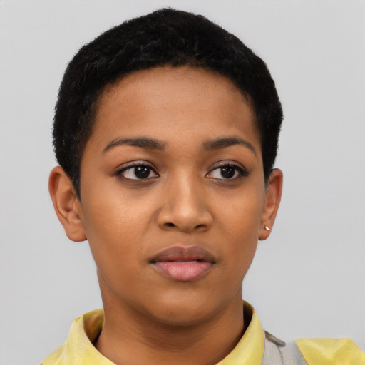 Joyful latino young-adult female with short  black hair and brown eyes