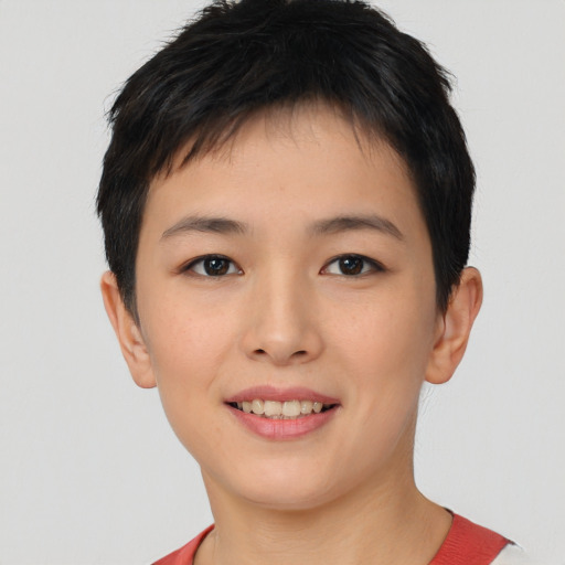 Joyful asian young-adult female with short  brown hair and brown eyes