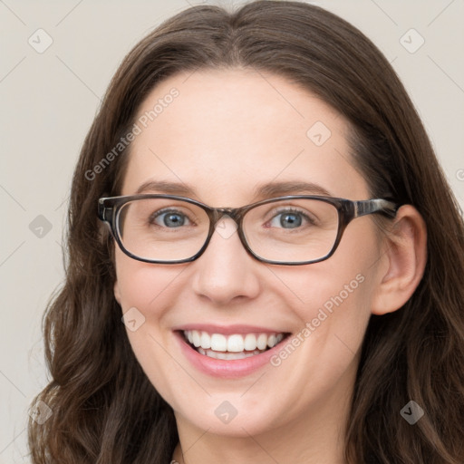 Joyful white young-adult female with long  brown hair and blue eyes