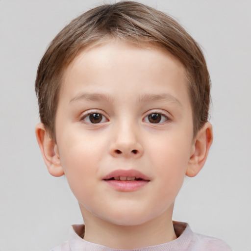 Joyful white child male with short  brown hair and brown eyes