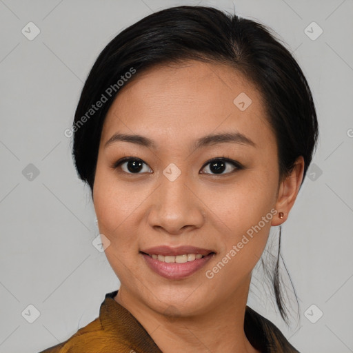 Joyful asian young-adult female with medium  black hair and brown eyes