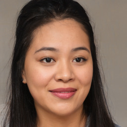 Joyful asian young-adult female with long  brown hair and brown eyes