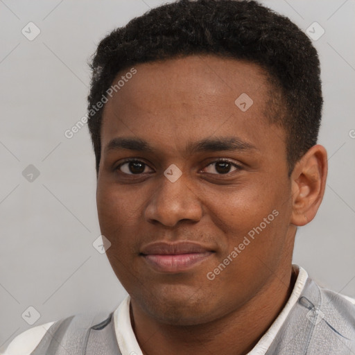 Joyful black young-adult male with short  brown hair and brown eyes