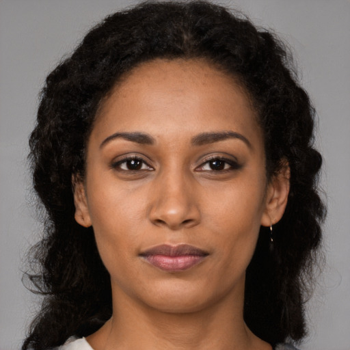 Neutral latino young-adult female with long  black hair and brown eyes