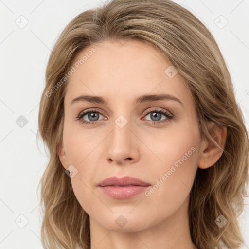 Joyful white young-adult female with long  brown hair and green eyes