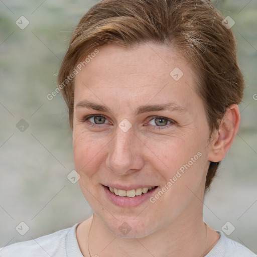 Joyful white adult female with short  brown hair and grey eyes