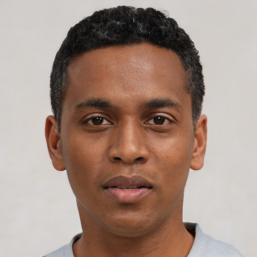Neutral black young-adult male with short  black hair and brown eyes