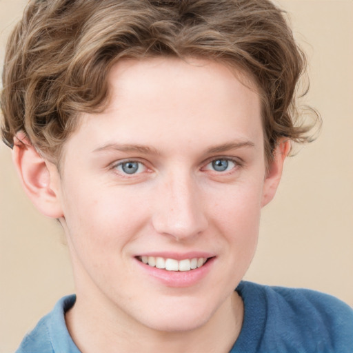 Joyful white young-adult female with short  brown hair and blue eyes