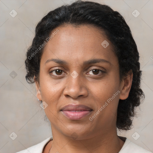 Joyful latino adult female with short  brown hair and brown eyes