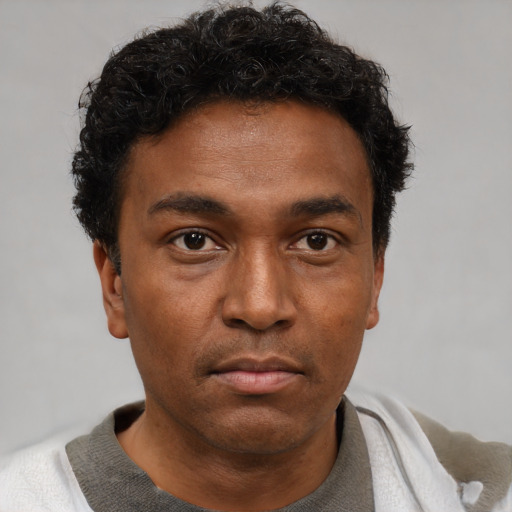Neutral black young-adult male with short  brown hair and brown eyes
