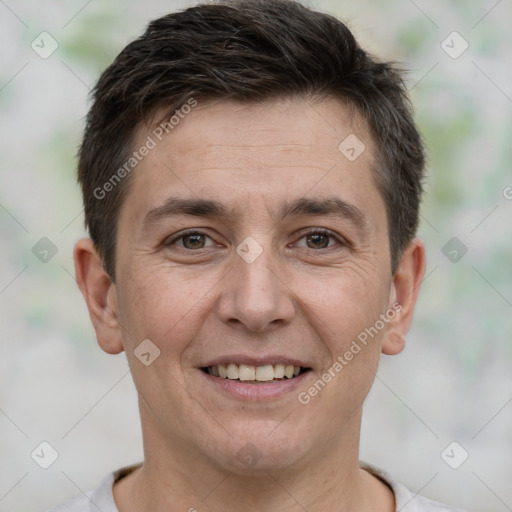 Joyful white adult male with short  brown hair and brown eyes