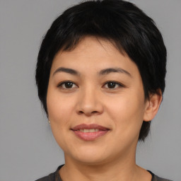 Joyful asian young-adult female with medium  black hair and brown eyes