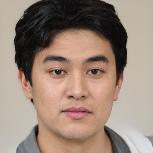 Neutral asian young-adult male with short  black hair and brown eyes