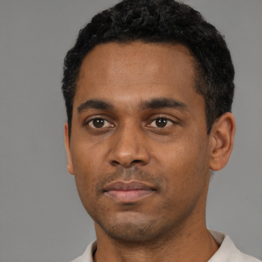 Neutral black young-adult male with short  black hair and brown eyes