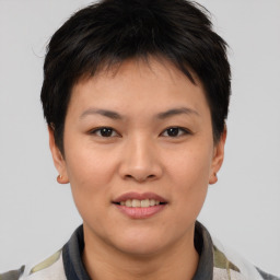 Joyful asian young-adult female with short  brown hair and brown eyes