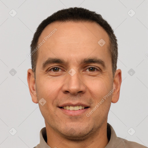 Joyful white adult male with short  brown hair and brown eyes