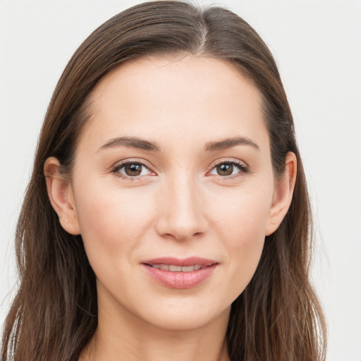 Joyful white young-adult female with long  brown hair and grey eyes