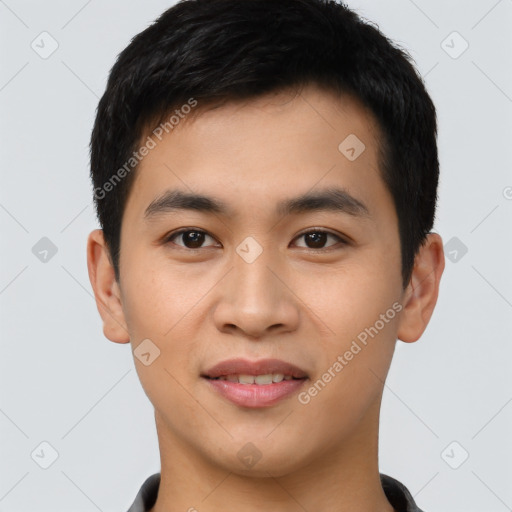 Joyful asian young-adult male with short  black hair and brown eyes