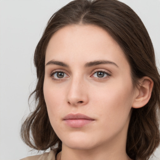 Neutral white young-adult female with medium  brown hair and grey eyes