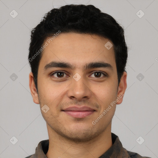 Joyful latino young-adult male with short  brown hair and brown eyes