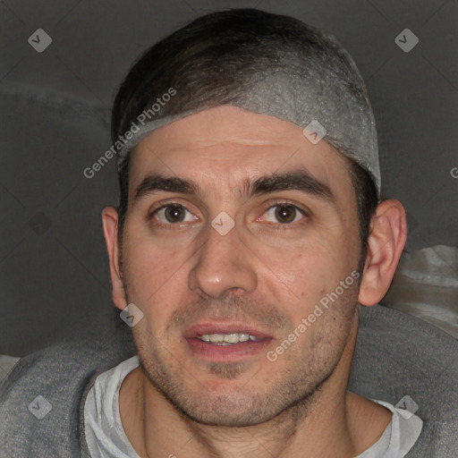 Joyful white adult male with short  brown hair and brown eyes