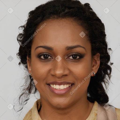 Joyful black young-adult female with long  brown hair and brown eyes