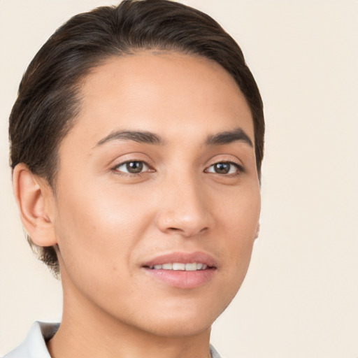 Joyful white young-adult female with short  brown hair and brown eyes