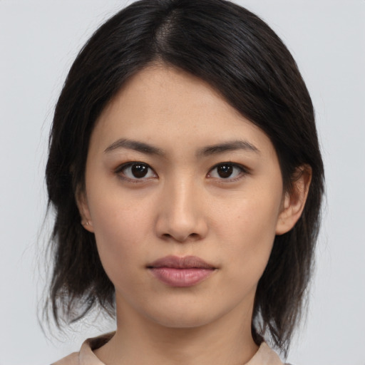 Neutral asian young-adult female with medium  brown hair and brown eyes