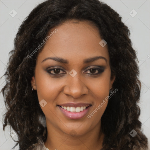 Joyful black young-adult female with long  brown hair and brown eyes