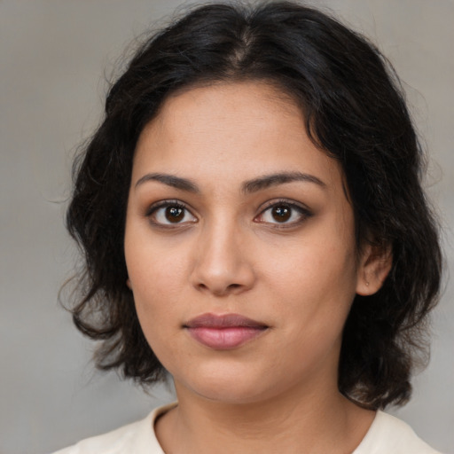 Neutral latino young-adult female with medium  brown hair and brown eyes