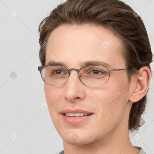 Joyful white adult male with short  brown hair and grey eyes