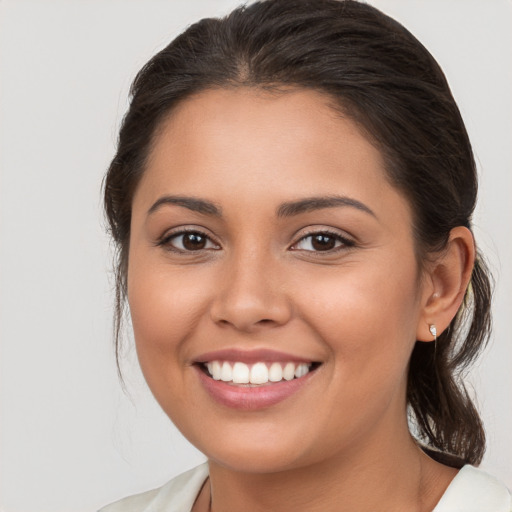 Joyful white young-adult female with medium  brown hair and brown eyes