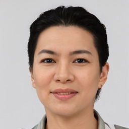 Joyful asian young-adult female with short  black hair and brown eyes