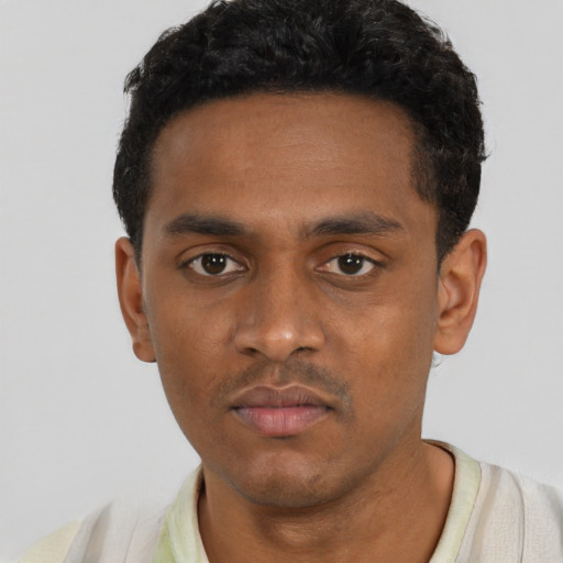 Neutral black young-adult male with short  black hair and brown eyes