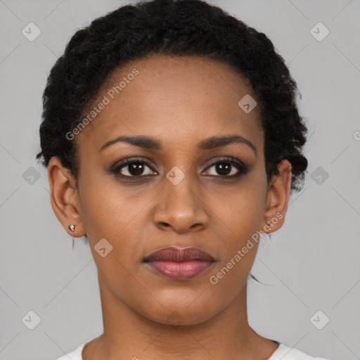 Joyful black young-adult female with short  black hair and brown eyes