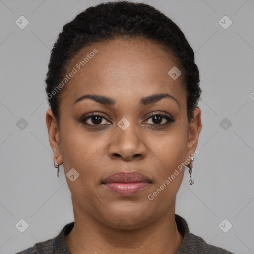 Joyful black young-adult female with short  black hair and brown eyes