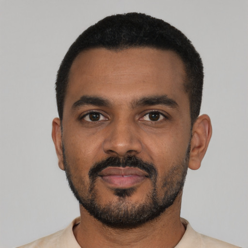 Neutral black young-adult male with short  black hair and brown eyes