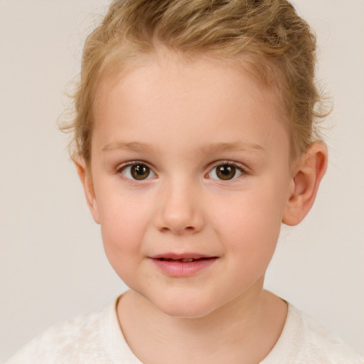 Joyful white child female with short  brown hair and brown eyes