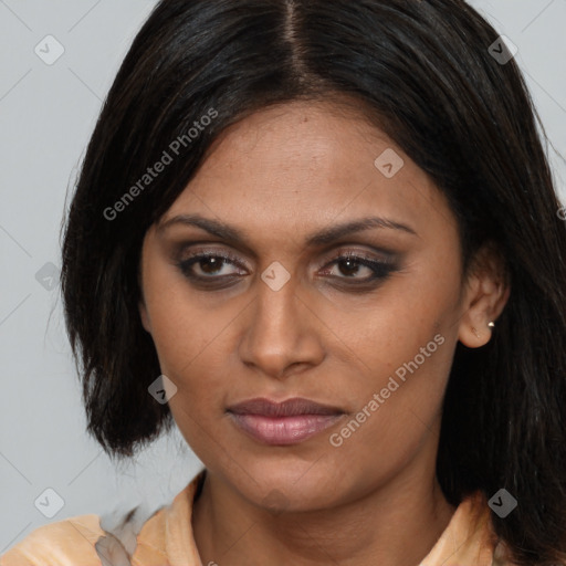 Joyful latino adult female with medium  brown hair and brown eyes