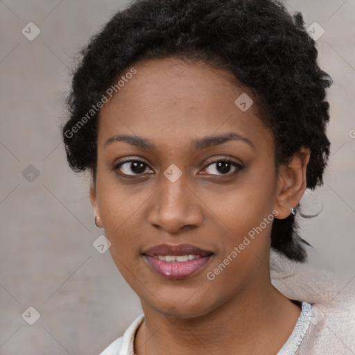 Joyful black young-adult female with short  black hair and brown eyes